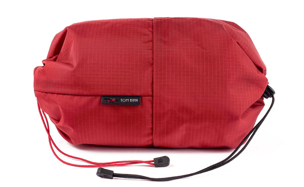 An Aeronaut 45 Travel Laundry Stuff Sack in Sangria (red with light red grid) 210 Cerylon.
